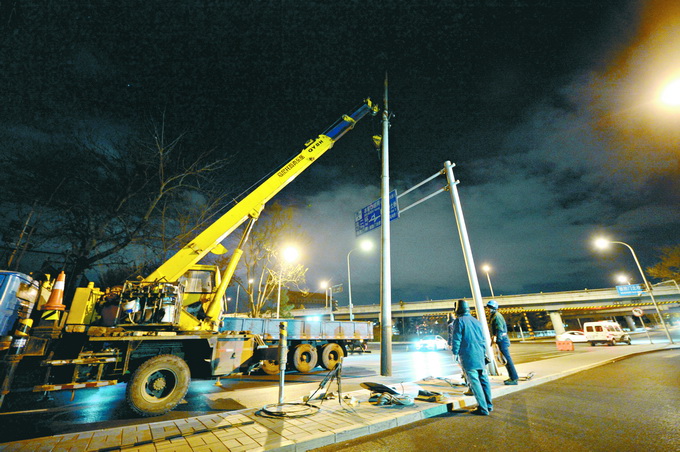 北京核心區架空線半數已入地 西城一宿拔掉線杆30根